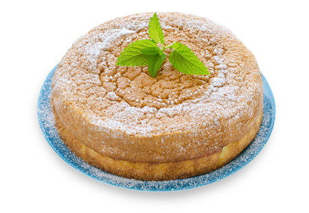 Japanese cheesecake decorated with icing sugar and mint on White Isolated Backgroundの写真素材