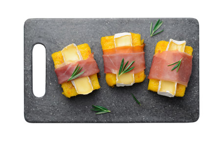 Polenta Bites with Prosciutto and Brie or Camembert Cheese, Polenta Appetizer, Delicious Snack on White Isolated Backgroundの写真素材