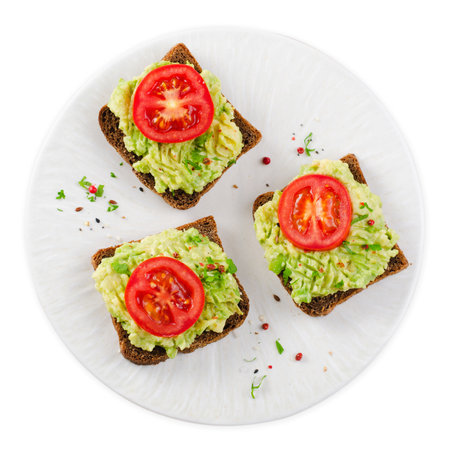 Avocado Toasts with Tomato, Healthy Snack or Breakfast on White Background Isolatedの写真素材