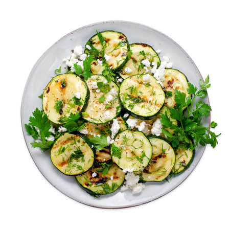 Grilled Zucchini Warm Salad, Zucchini, Feta, Corn and Herbs Appetizer, Salad on White Isolated Backgroundの写真素材