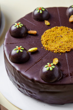 Pistachio Chocolate Cake, Whole Decorated Cake on Bright Backgroundの写真素材
