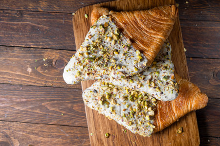 Flat Croissant, Trendy Pastry, Croissant with Pistachio Glaze and Crushed Nuts