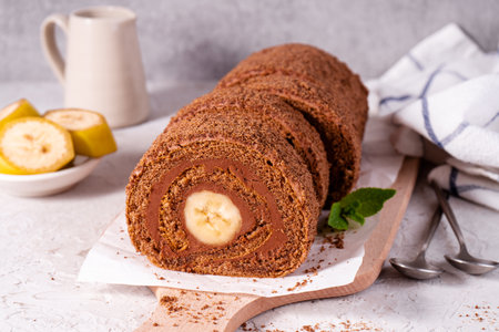 Banana Chocolate Swiss Roll Cake, Sponge Roll with Chocolate Filling and Bananaの写真素材
