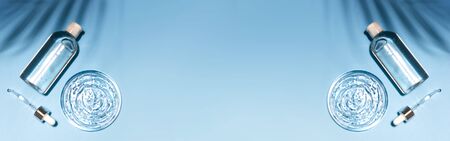 Antibacterial, hyaluron gel bottle, pipette and transparent cosmetic serum smear on blueの写真素材