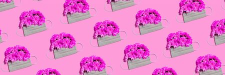 Medical protection face mask with chrysanthemum flowers on pinkの写真素材