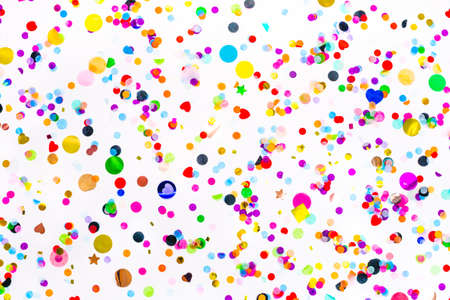 colorful paper and foil confetti wallpaper. party pattern, white background. luxury festive holiday. creative glitter decoration. congratulations, new year, birthday, wedding, christmas flat layの写真素材