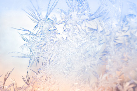 Shiny freeze winter frost on glass window. Abstract macro wallpaper. Frosty pattern bright backdrop....