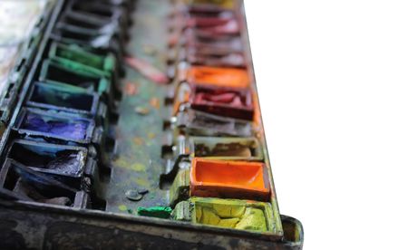 well-used paintbox in over white backgroundの写真素材