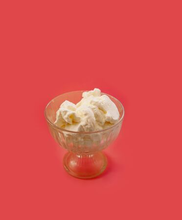 ice-cream with whipped cream on a pink backgroundの写真素材