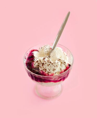 whipped cream dessert with chocolate and jam in a glass bowlの写真素材