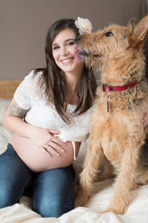 Candid portrait of a natural woman with tattoos and her german shepard mixed dogの写真素材