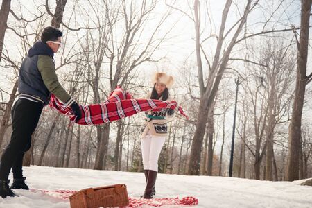Group of friends enjoying in the snow in winterの写真素材