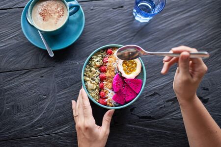Close up of a Smootie bowl breakfast filled with fruitの写真素材