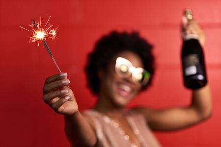 Attractive young african american woman celebrating New yearの写真素材