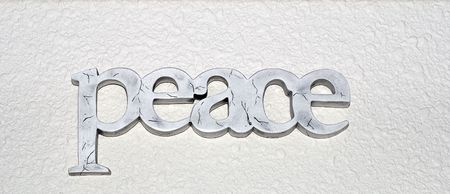 wood painted letters spelling the word peaceの写真素材