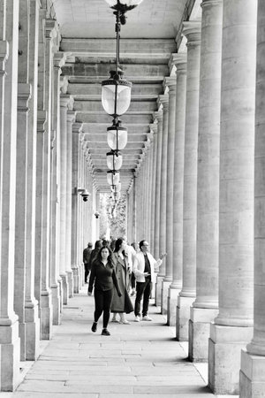 People walking in Buren's columns of Paris, France Black and whiteの写真素材