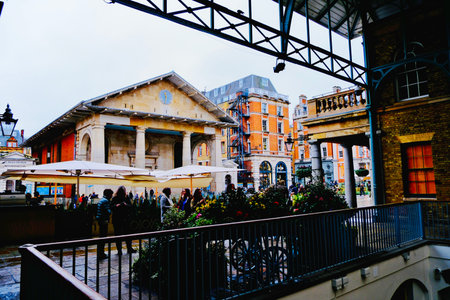 Tourists and local people walking in Covent Garden, London, UK
