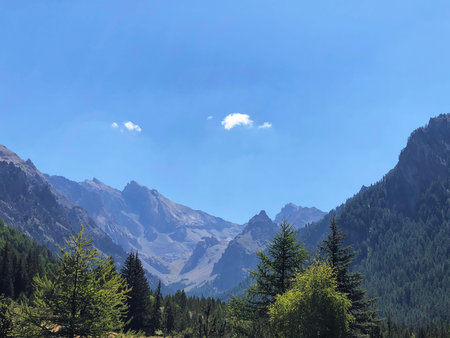 mountain landscape with blue sky and white clouds in the italian alpsの写真素材
