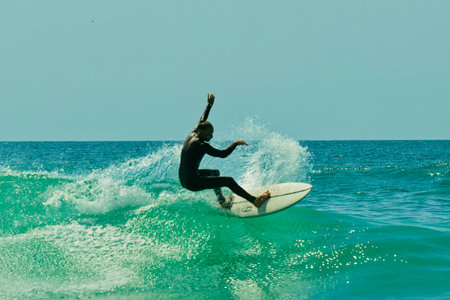 Surfer in action on a beautiful sunny day. Surfing on the ocean wave. Lacanau, Franceの写真素材