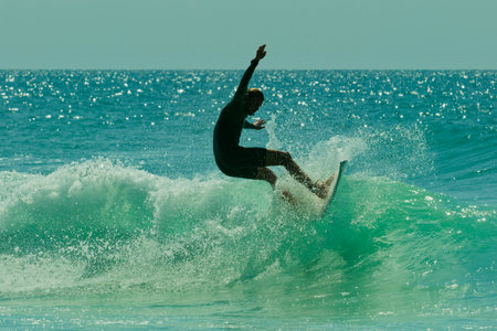 Surfer in action on a beautiful sunny day. Surfing on the ocean wave. Lacanau, Franceの写真素材