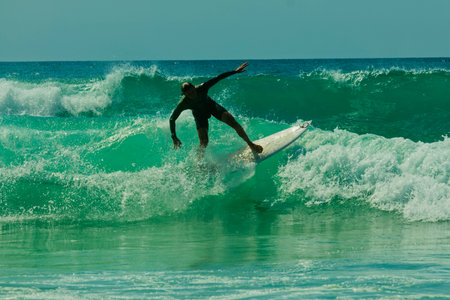 Surfer in action on a beautiful sunny day. Surfing on the ocean wave. Lacanau, Franceの写真素材