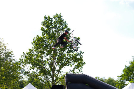 Unidentified BMX rider jumps over obstacles at the European Games.