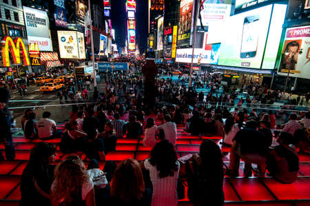 Spectators taking in the splendor of Times Square all lit up at night.  September 25th 2010.のeditorial素材
