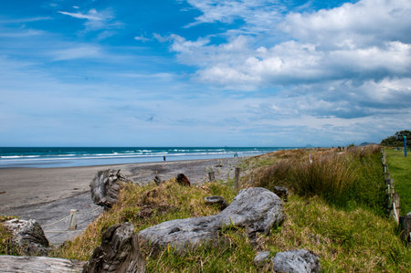 Waihi Beach is a beautiful 9km-long authentic kiwi sandy beach known for its surfing is located in the Bay of Plenty on the north island of New Zealand.の写真素材