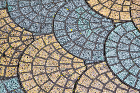 Street paving tiles in the form of fan or shell blue and yellow