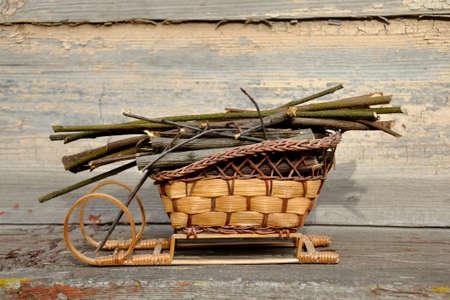 decorative wooden sledge with branchesの写真素材