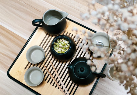 Chinese tea set in flowers top viewの写真素材