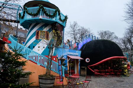Copenhagen / Denmark - November 2019: Empty playground in Tivoli Gardens during Christmas time. Decorated park for tourists. Famous holidays entertainment place for kids activities. No people around.の写真素材