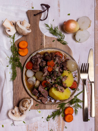 French cuisine Beef Burgundy with potatoes on a ceramic plate