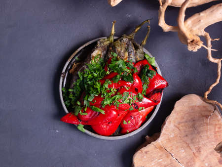 Roasted peppers and eggplants on a dark backgroundの写真素材