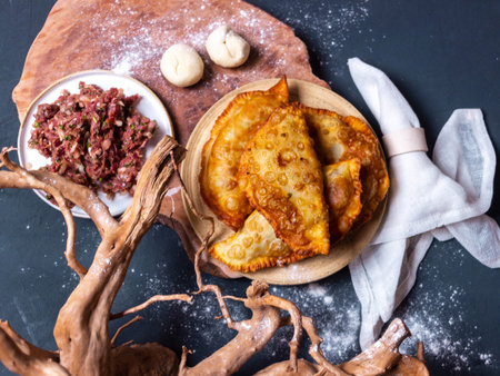 deep-fried chir-chir cheburek on a dark background