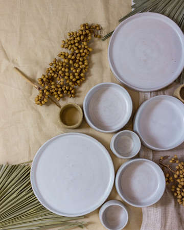 modern table setting with white ceramic tablewareの写真素材