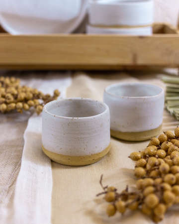 modern table setting with white ceramic tablewareの写真素材