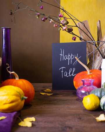 Autumn still life with pumpkins and candles