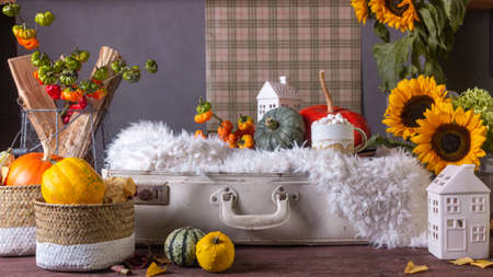Autumn still life with pumpkins and plaids candles on a wooden backgroundの写真素材