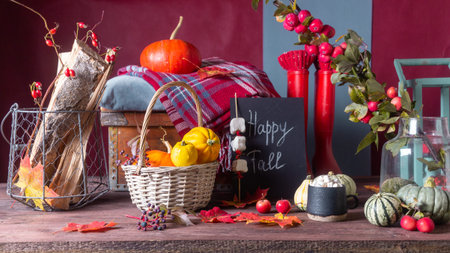 Autumn still life with pumpkins and plaids candles on a wooden background