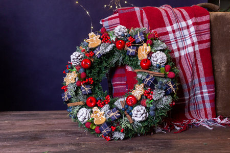 Christmas traditional red wreath on a light backgroundの写真素材