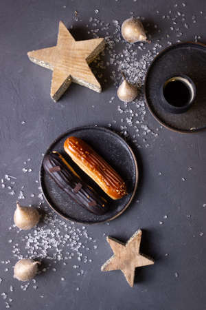 still life with eclairs on a dark backgroundの写真素材