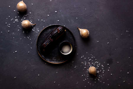 still life with eclairs on a dark backgroundの写真素材