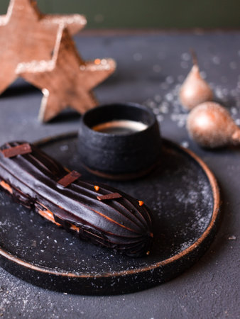 still life with eclairs on a dark background