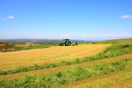 Beautiful lansdscape with Haymaking in Sotlandの写真素材