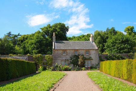 Garden with old cottage in Scotland, Ayrshireの写真素材