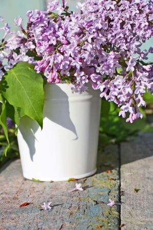 Beautiful , soft lilac in a white vase retro style の写真素材