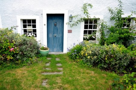 Old, traditional, scottish house and the gardenの写真素材