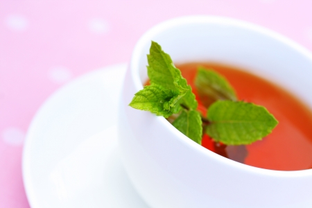 Mint tea in a white cup close up の写真素材