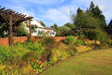 Beautiful garden in the park with wooden pergolaのeditorial素材